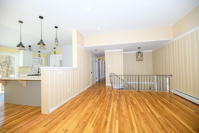 24 Hampton Falls Rd, Exeter, NH 03833 - spare room with light wood finished floors and a baseboard radiator