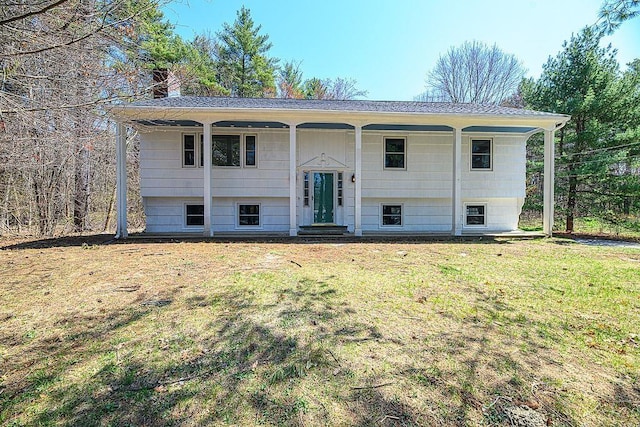24 Hampton Falls Rd, Exeter, NH 03833 - bi-level home featuring a front yard and a chimney