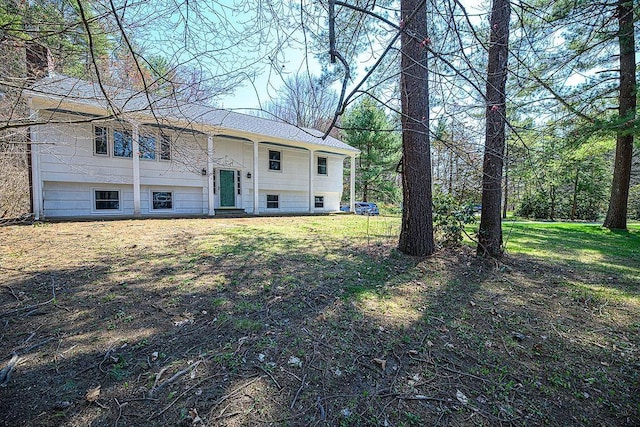 24 Hampton Falls Rd, Exeter, NH 03833 - back of property with a yard and a shingled roof