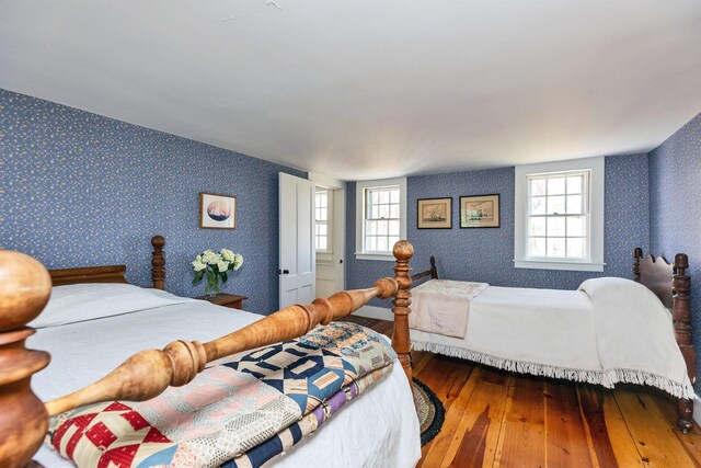 161 Upper Jaffrey Rd, Dublin, NH 03444 - bedroom featuring wood-type flooring, wallpapered walls, and multiple windows