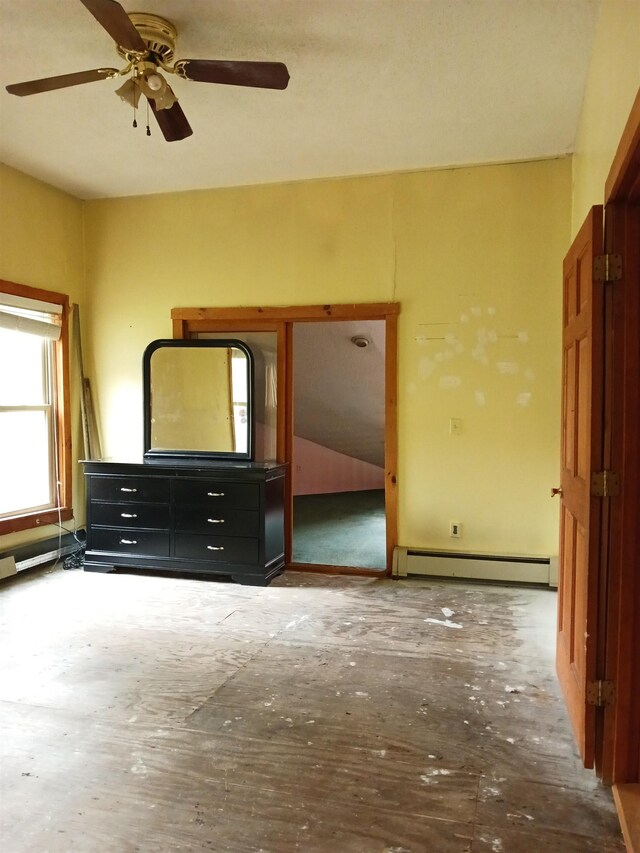 3730 Rte 100, Wardsboro, VT 05355 - unfurnished bedroom featuring a baseboard radiator and ceiling fan
