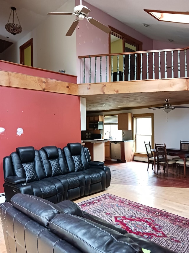 3730 Rte 100, Wardsboro, VT 05355 - living room featuring light wood-type flooring, ceiling fan, and a high ceiling