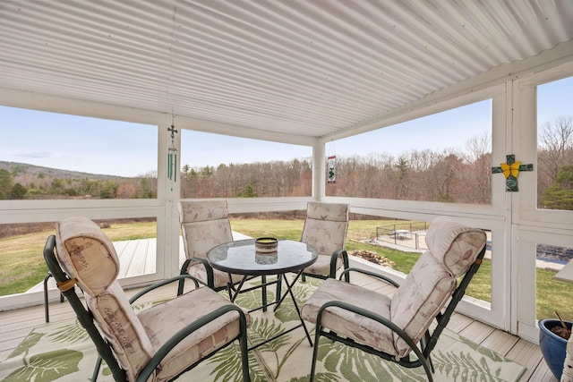 sunroom with a forest view