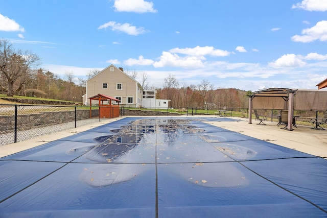 view of pool with fence, a gazebo, a fenced in pool, and a pergola