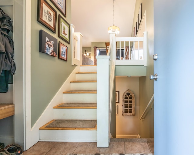 staircase with tile patterned flooring