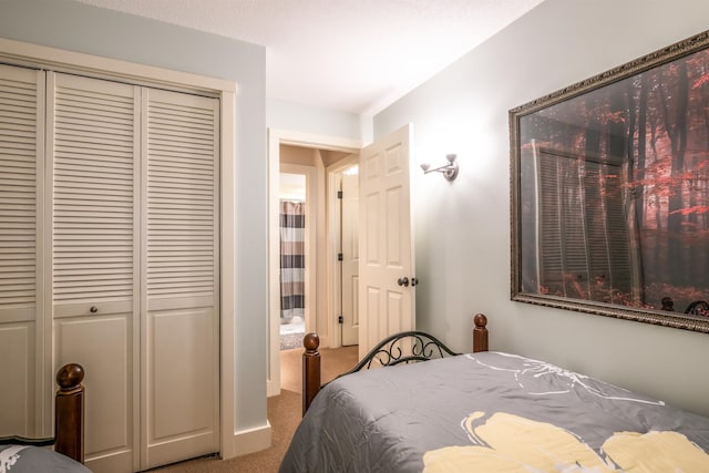 bedroom featuring a closet and carpet flooring