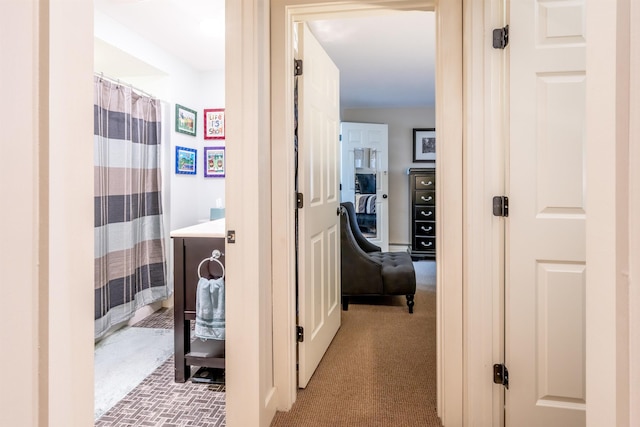 hallway featuring light carpet