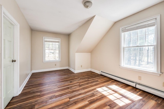 bonus room featuring baseboards, vaulted ceiling, dark wood-type flooring, and a baseboard radiator