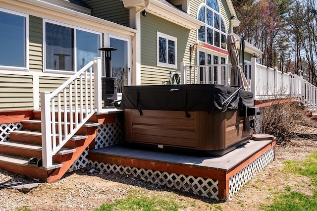 wooden terrace with a hot tub