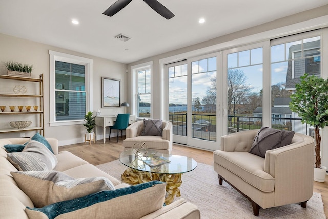 interior space featuring visible vents and a healthy amount of sunlight