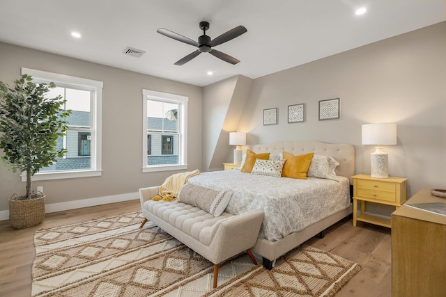 bedroom featuring visible vents, baseboards, recessed lighting, wood finished floors, and a ceiling fan