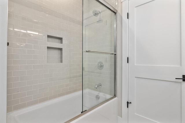 full bathroom featuring bath / shower combo with glass door