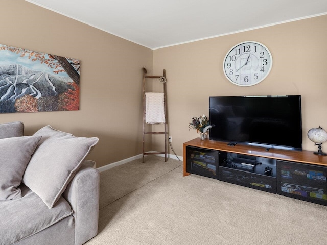 living room featuring carpet flooring, baseboards, and ornamental molding
