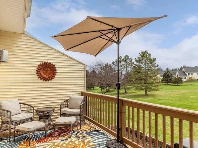wooden terrace with a lawn