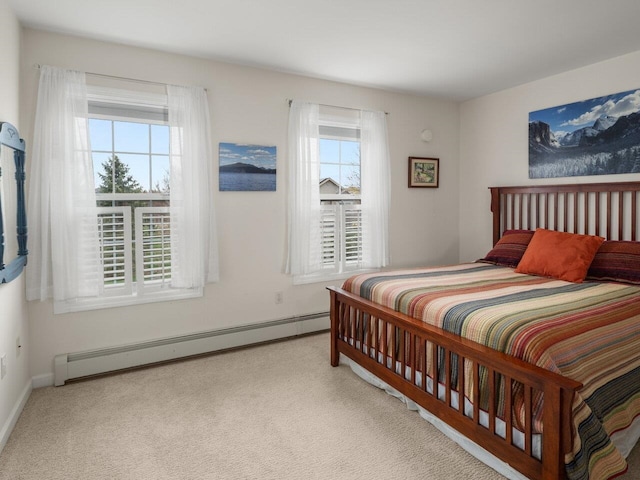 bedroom with carpet, baseboards, and baseboard heating