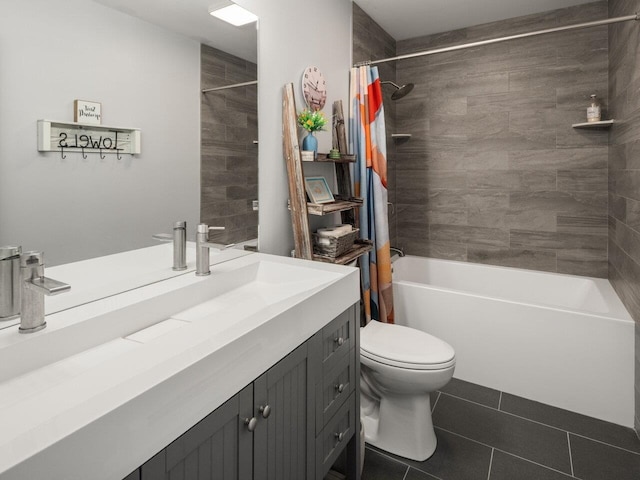 full bathroom with tile patterned floors, vanity, toilet, and shower / tub combo
