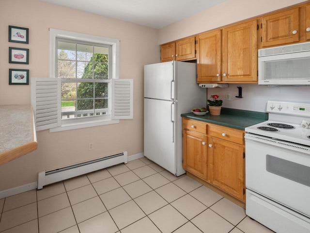kitchen with dark countertops, white appliances, brown cabinetry, baseboards, and a baseboard radiator
