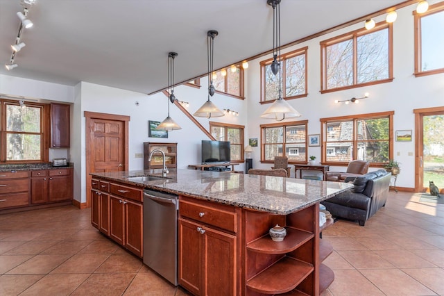 107-109 Baker Rd, Springfield, VT 05156 - kitchen with open floor plan, open shelves, dishwasher, and a sink