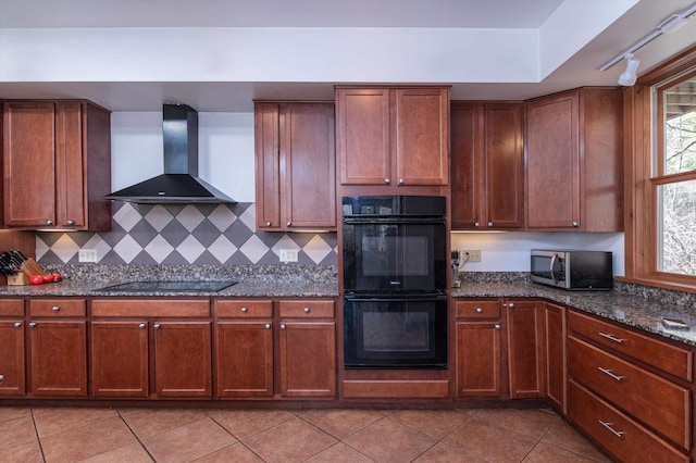 107-109 Baker Rd, Springfield, VT 05156 - kitchen with light tile patterned floors, black appliances, wall chimney range hood, and dark stone counters