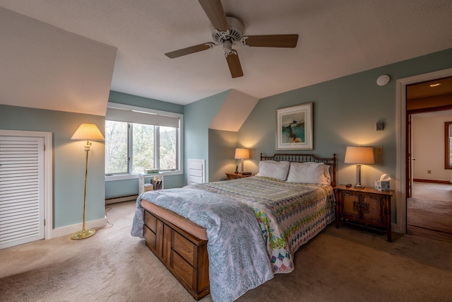 carpeted bedroom with ceiling fan and baseboards