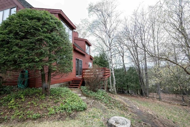 view of yard featuring a wooden deck