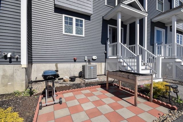 view of patio / terrace featuring area for grilling and central air condition unit
