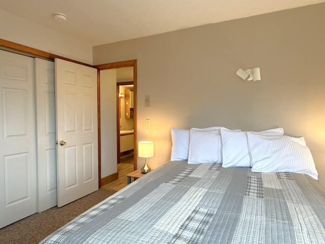 bedroom with carpet and a closet
