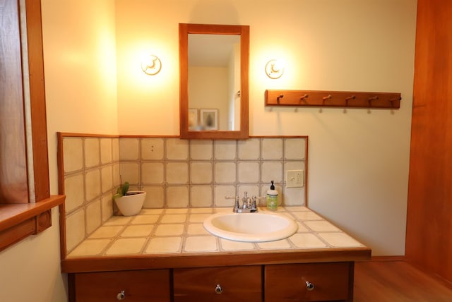 bathroom featuring backsplash and vanity