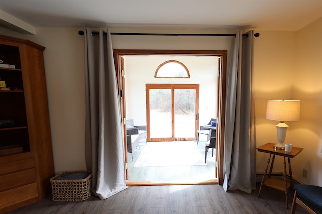 doorway to outside with wood finished floors