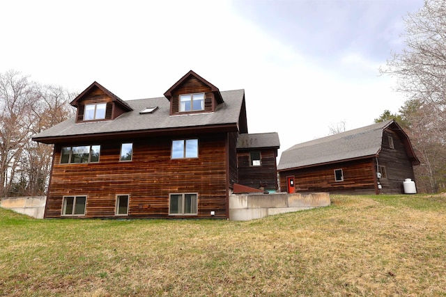 back of house with a yard