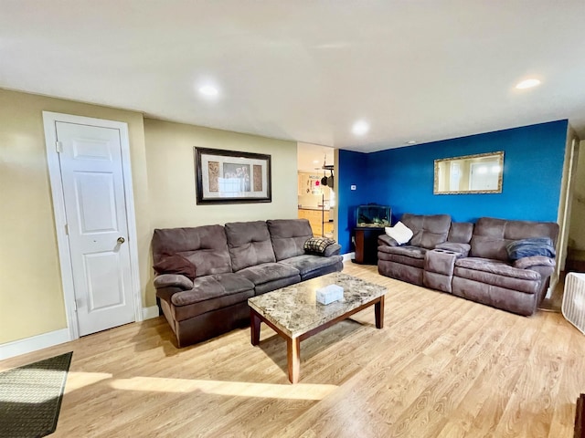 living area with recessed lighting, wood finished floors, and baseboards