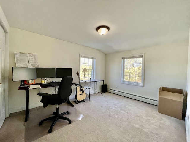 carpeted office space featuring baseboards, a baseboard heating unit, and lofted ceiling