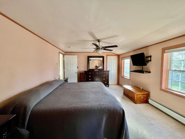 carpeted bedroom with a ceiling fan, baseboard heating, and multiple windows