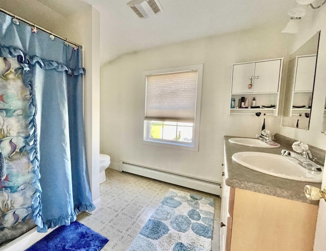 bathroom featuring toilet, a sink, baseboard heating, and visible vents
