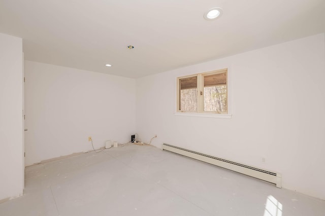 spare room featuring recessed lighting and baseboard heating