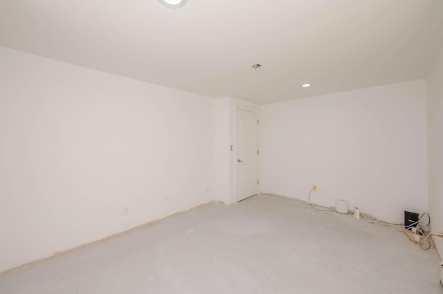 unfurnished room featuring recessed lighting and concrete floors