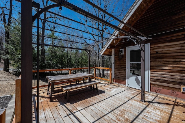deck featuring outdoor dining area