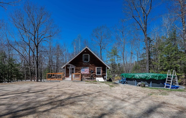 chalet / cabin with a wooden deck