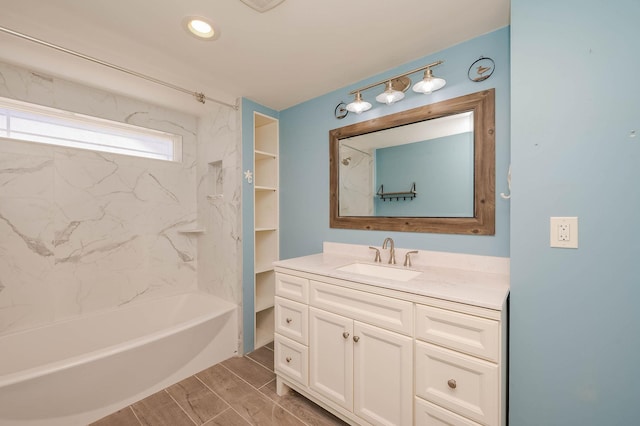 bathroom featuring shower / tub combination and vanity
