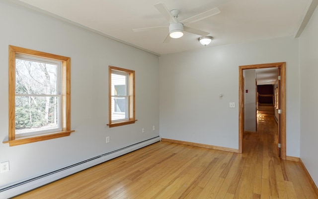 152 E St, Charlestown, NH 03603 - empty room with light wood-style floors, a ceiling fan, baseboards, and baseboard heating