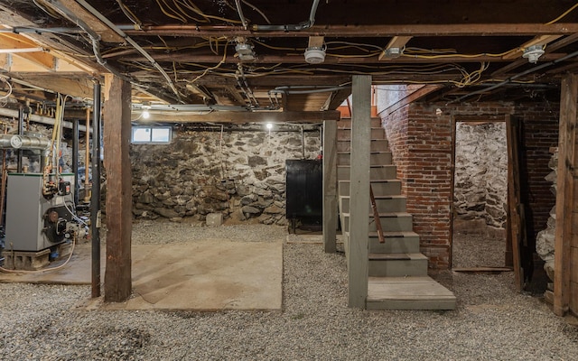 152 E St, Charlestown, NH 03603 - basement with a heating unit, heating fuel, and stairway