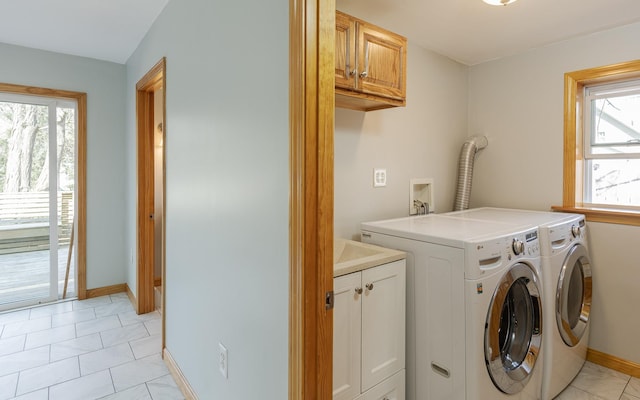 152 E St, Charlestown, NH 03603 - laundry room with separate washer and dryer, cabinet space, and baseboards