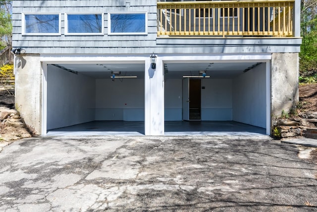 garage featuring aphalt driveway