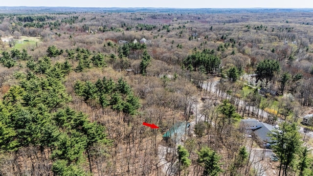 birds eye view of property with a wooded view