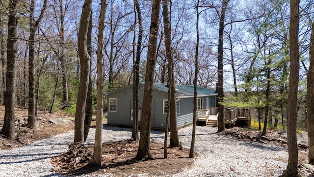 view of side of home with a deck