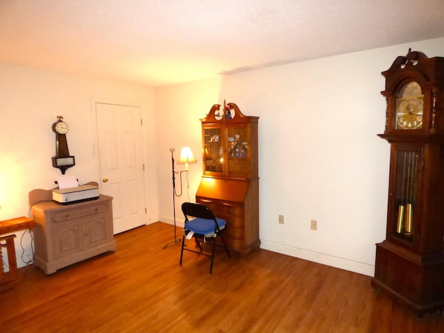 office area with wood finished floors and baseboards