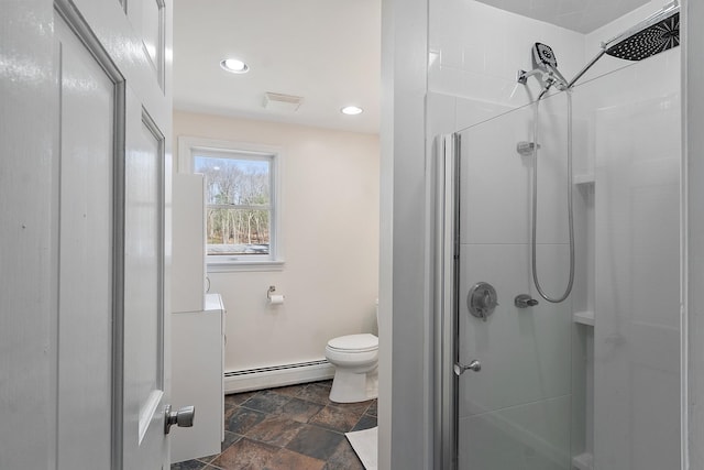 full bathroom featuring a shower stall, stone finish flooring, visible vents, baseboard heating, and toilet