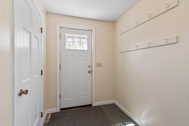 entryway featuring baseboards