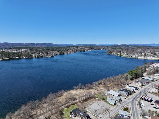 bird's eye view with a water and mountain view