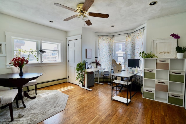 office area featuring recessed lighting, ceiling fan, and hardwood / wood-style flooring
